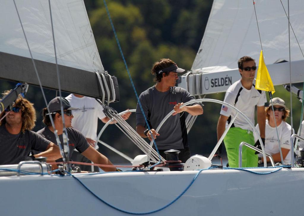 Skipper David Gilmour of Team Gilmour looks back during pre start of a match against Dustin Durant of Long Beach Match Racing, in the Oakcliff International on the second day of competition, in Cold Spring Harbor near Oyster Bay, NY on September 6, 2013. © 2013 Molly Riley/Oakcliff